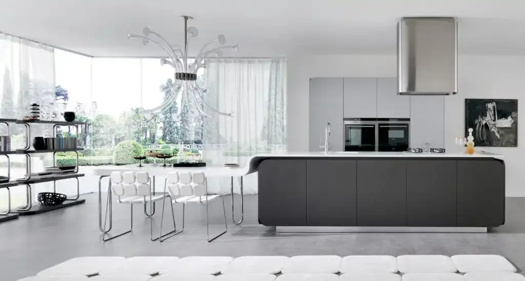 open concept modern kitchen with island transitioning into dining table.